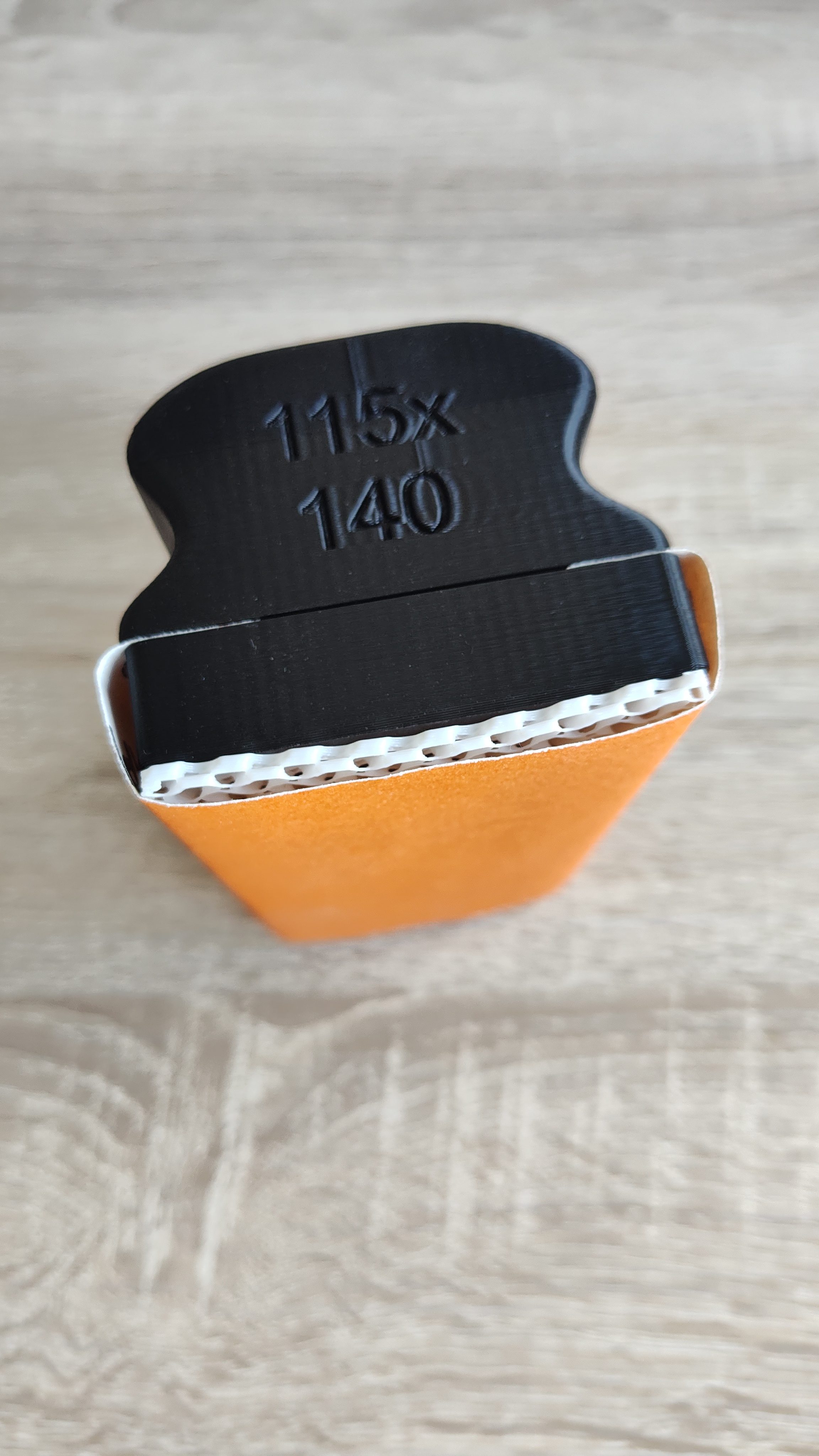 An assembled 3D printed sander tool with the TPU pad